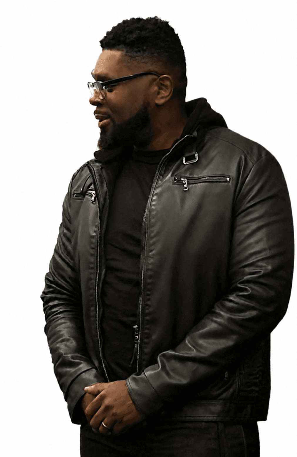 John Castor wearing glasses and a black leather jacket